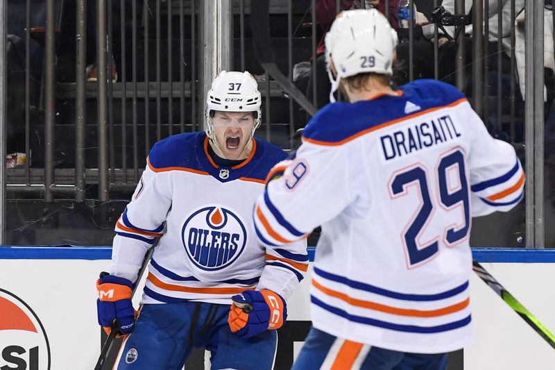 Dec 22, 2023; New York, New York, USA;  Edmonton Oilers left wing Warren Foegele (37) celebrates his goal against the New York Rangers during the third period at Madison Square Garden. Mandatory Credit: Dennis Schneidler-USA TODAY Sports