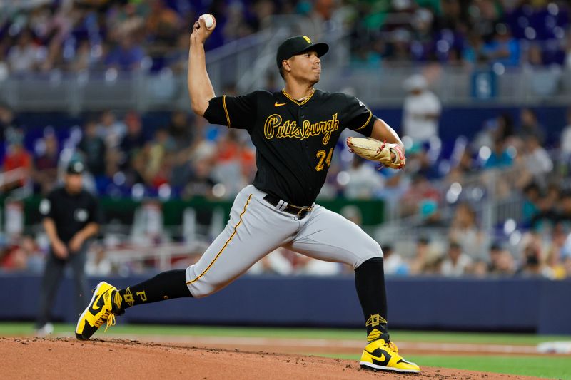 Jun 25, 2023; Miami, Florida, USA; Pittsburgh Pirates starting pitcher Johan Oviedo (24) delivers a pitch against the Miami Marlins during the first inning at loanDepot Park. Mandatory Credit: Sam Navarro-USA TODAY Sports