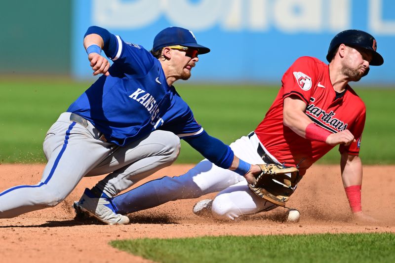 Aug 28, 2024; Cleveland, Ohio, USA; Cleveland Guardians pinch runner Lane Thomas (8) steals second as Kansas City Royals shortstop Bobby Witt Jr. (7) misses the throw during the eighth inning at Progressive Field. Mandatory Credit: Ken Blaze-USA TODAY Sports