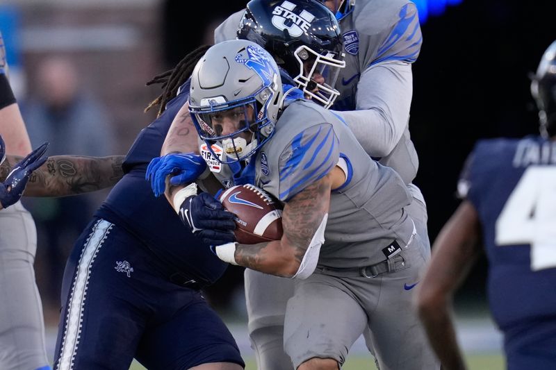 Dec 27, 2022; Dallas, Texas, USA; Memphis Tigers running back Jevyon Ducker (8) runs the ball against the Utah State Aggies during the second half in the 2022 First Responder Bowl at Gerald J. Ford Stadium. Mandatory Credit: Chris Jones-USA TODAY Sports