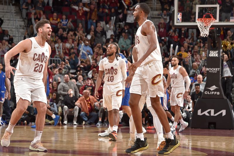 CLEVELAND, OH - MARCH 29: Evan Mobley #4 and Georges Niang #20  of the Cleveland Cavaliers celebrate during the game against the Philadelphia 76ers on March 29, 2024 at Rocket Mortgage FieldHouse in Cleveland, Ohio. NOTE TO USER: User expressly acknowledges and agrees that, by downloading and/or using this Photograph, user is consenting to the terms and conditions of the Getty Images License Agreement. Mandatory Copyright Notice: Copyright 2024 NBAE (Photo by David Liam Kyle/NBAE via Getty Images)