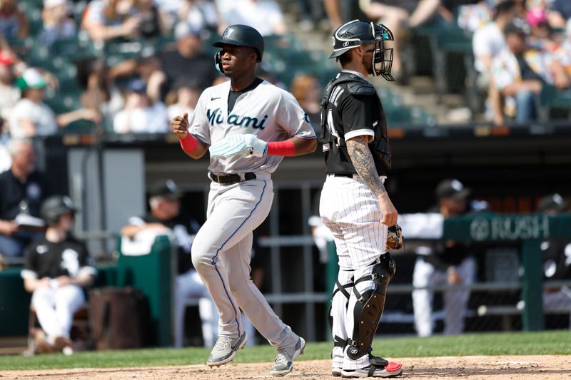 Jun 10, 2023; Chicago, Illinois, USA; Miami Marlins right fielder Jesus Sanchez (7) scores against the Chicago White Sox during the ninth inning at Guaranteed Rate Field. Mandatory Credit: Kamil Krzaczynski-USA TODAY Sports