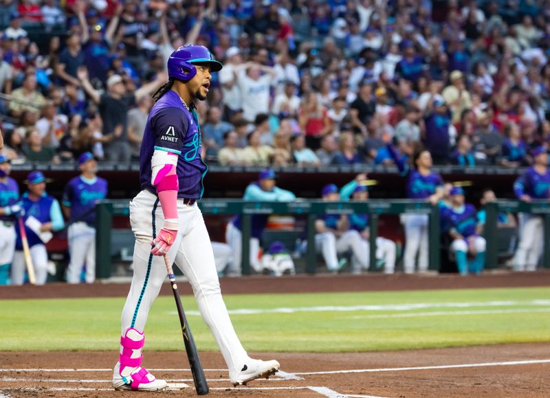 May 9, 2025; Phoenix, Arizona, USA; Arizona Diamondbacks second baseman Ketel Marte reacts after hitting a home run in the first inning against the Los Angeles Dodgers at Chase Field. Mandatory Credit: Mark J. Rebilas-Imagn Images