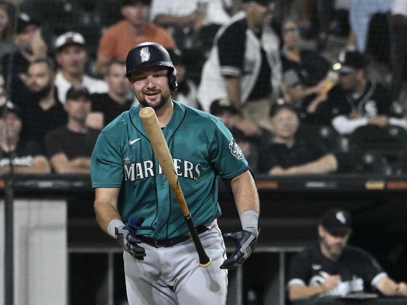 Aug 21, 2023; Chicago, Illinois, USA;  Seattle Mariners catcher Cal Raleigh (29) flips hs bat after striking out swinging against the Chicago White Sox during the sixth inning at Guaranteed Rate Field. Mandatory Credit: Matt Marton-USA TODAY Sports