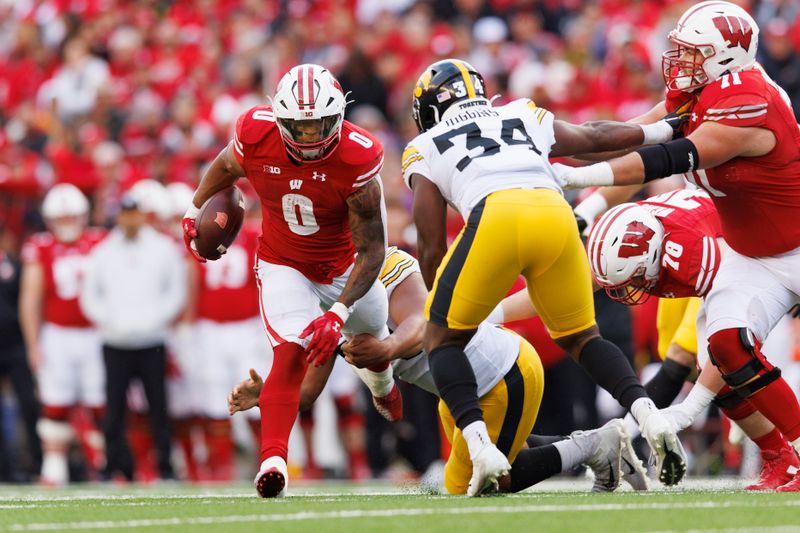 Oct 14, 2023; Madison, Wisconsin, USA;  Wisconsin Badgers running back Braelon Allen (0) rushes with the football during the third quarter against the Iowa Hawkeyes at Camp Randall Stadium. Mandatory Credit: Jeff Hanisch-USA TODAY Sports