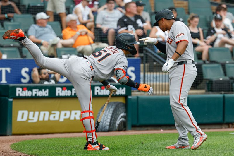 Jun 29, 2025; Chicago, Illinois, USA; San Francisco Giants designated hitter Rafael Devers (16) celebrates with center fielder Jung Hoo Lee (51) after scoring against the Chicago White Sox during the fifth inning at Rate Field. Mandatory Credit: Kamil Krzaczynski-Imagn Images