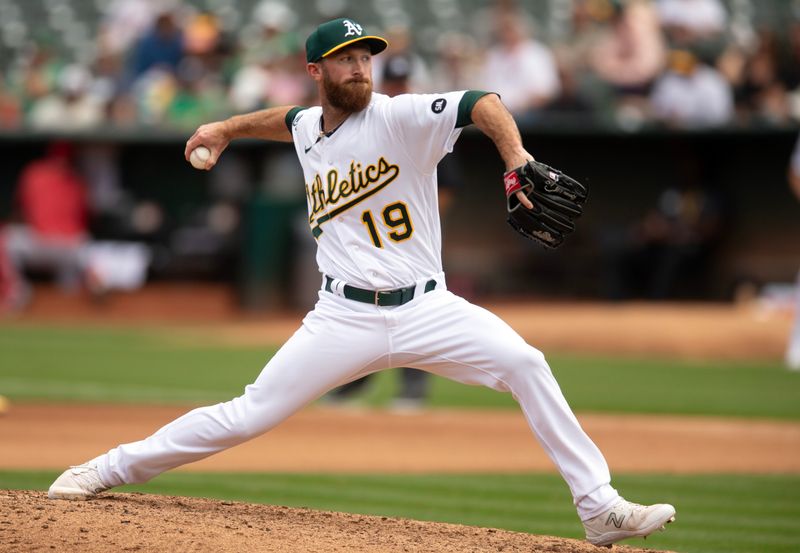 Sep 2, 2023; Oakland, California, USA; Oakland Athletics pitcher Spencer Patton (19) delivers a pitch against the Los Angeles Angels during the seventh inning at Oakland-Alameda County Coliseum. Mandatory Credit: D. Ross Cameron-USA TODAY Sports