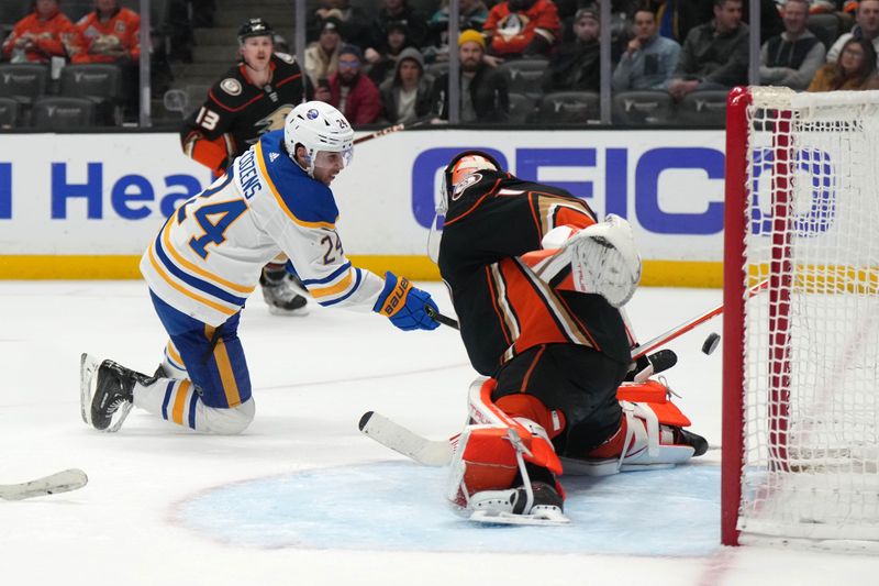 Feb 15, 2023; Anaheim, California, USA; Buffalo Sabres center Dylan Cozens (24) shoots the puck past Anaheim Ducks goaltender Lukas Dostal (1) for a goal in the third period  at Honda Center. Mandatory Credit: Kirby Lee-USA TODAY Sports