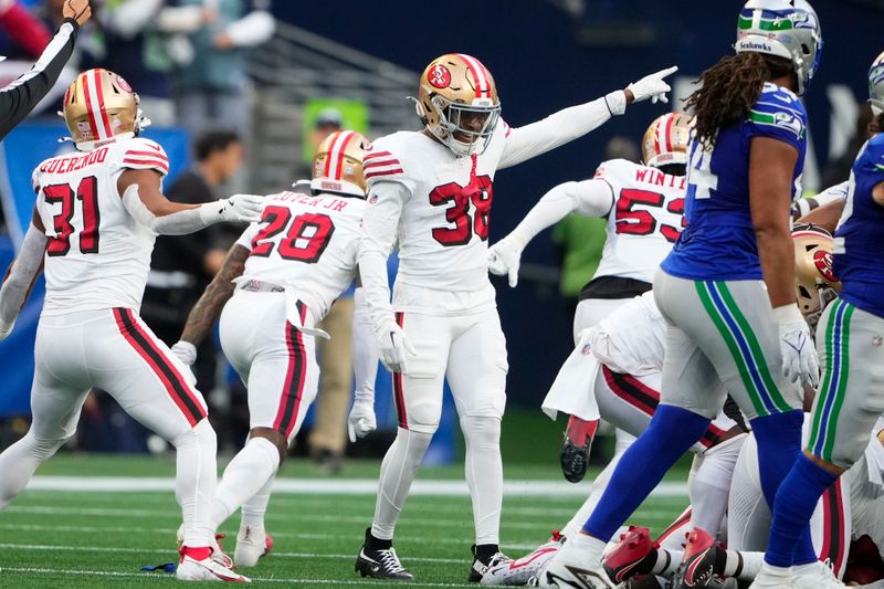 San Francisco 49ers safety Jaylen Mahoney (38) celebrates a fumble recovery during the first half of an NFL football game against the Seattle Seahawks, Thursday, Oct. 10, 2024, in Seattle. (AP Photo/Lindsey Wasson)