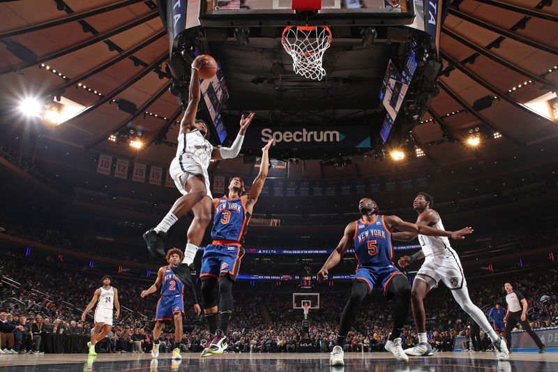 NEW YORK, NY - MARCH 23: Dennis Smith Jr. #4 of the Brooklyn Nets drives to the basket during the game against the New York Knicks on March 23, 2024 at Madison Square Garden in New York City, New York.  NOTE TO USER: User expressly acknowledges and agrees that, by downloading and or using this photograph, User is consenting to the terms and conditions of the Getty Images License Agreement. Mandatory Copyright Notice: Copyright 2024 NBAE  (Photo by Nathaniel S. Butler/NBAE via Getty Images)