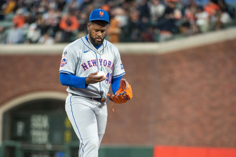 Apr 23, 2024; San Francisco, California, USA; New York Mets pitcher Luis Severino (40) examines the baseball during the fifth inning against the San Francisco Giants at Oracle Park. Mandatory Credit: Ed Szczepanski-USA TODAY Sports