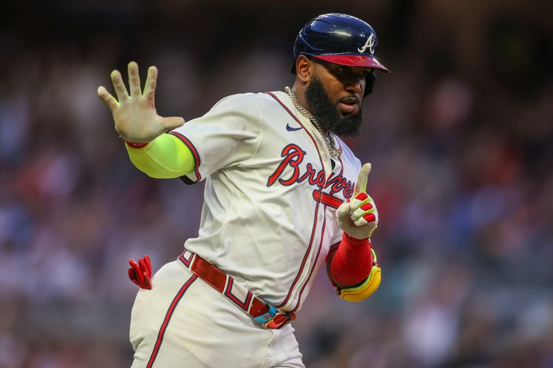 May 8, 2024; Atlanta, Georgia, USA; Atlanta Braves designated hitter Marcell Ozuna (20) celebrates after a home run against the Boston Red Sox in the third inning at Truist Park. Mandatory Credit: Brett Davis-USA TODAY Sports
