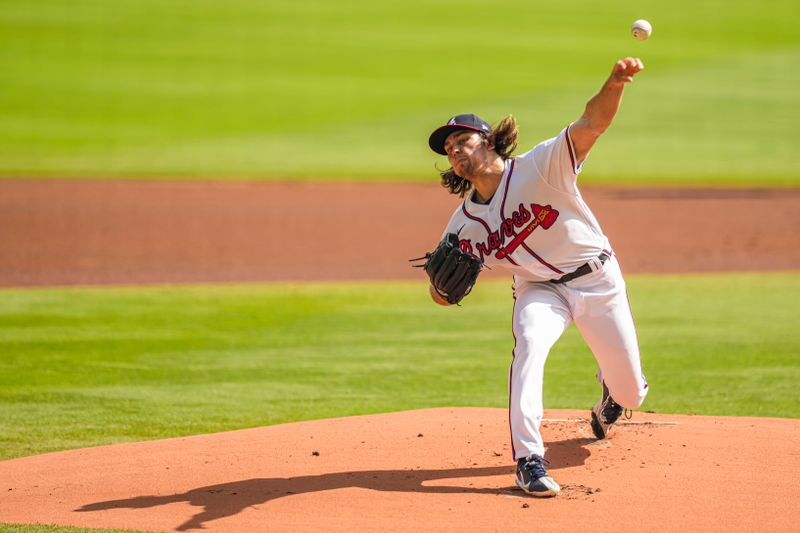 Oct 1, 2023; Cumberland, Georgia, USA; Atlanta Braves starting pitcher Dylan Dodd (46) pitches against the Washington Nationals during the first inning at Truist Park. Mandatory Credit: Dale Zanine-USA TODAY Sports