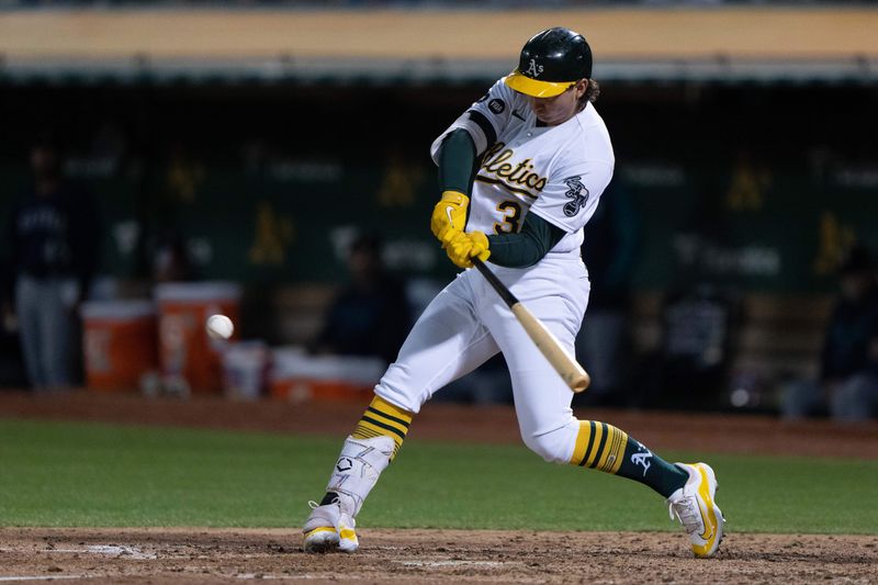 Sep 18, 2023; Oakland, California, USA;  Oakland Athletics catcher Tyler Soderstrom (37) hits a single during the fourth inning against the Seattle Mariners at Oakland-Alameda County Coliseum. Mandatory Credit: Stan Szeto-USA TODAY Sports