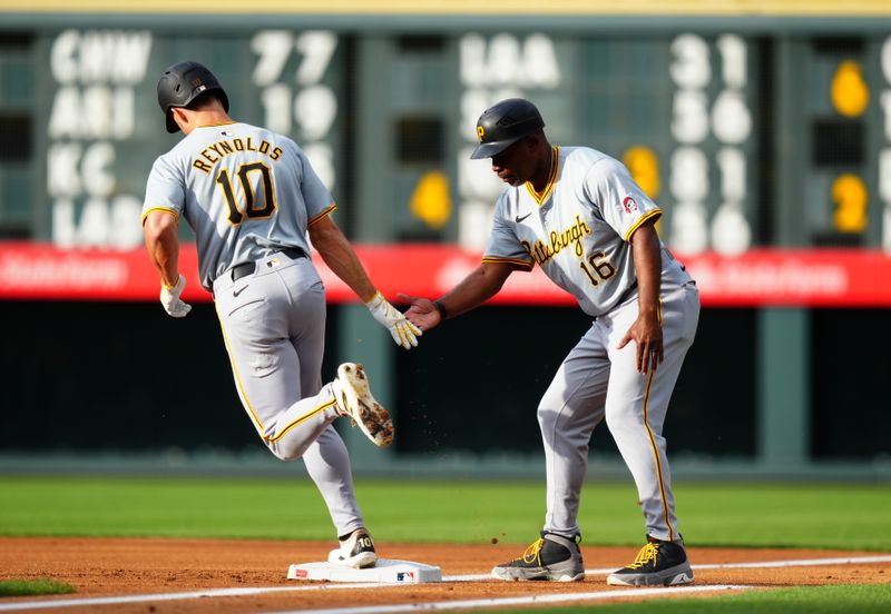 Jun 14, 2024; Denver, Colorado, USA; Pittsburgh Pirates left fielder Bryan Reynolds (10) celebrates his solo home run with first base coach Tarrik Brock (16) in the first inning against the Colorado Rockies at Coors Field. Mandatory Credit: Ron Chenoy-USA TODAY Sports