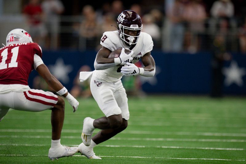 Sep 30, 2023; Arlington, Texas, USA; Texas A&M Aggies running back Le'Veon Moss (8) runs with the ball against the Arkansas Razorbacks during the first half at AT&T Stadium. Mandatory Credit: Jerome Miron-USA TODAY Sports