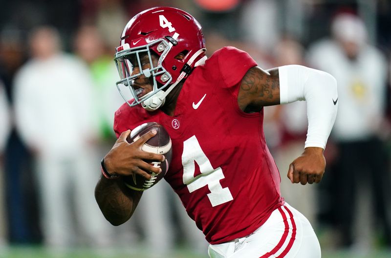 Nov 4, 2023; Tuscaloosa, Alabama, USA; Alabama Crimson Tide quarterback Jalen Milroe (4) scrambles up the field against the LSU Tigers during the second quarter at Bryant-Denny Stadium. Mandatory Credit: John David Mercer-USA TODAY Sports