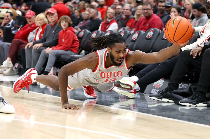 Dec 6, 2023; Columbus, Ohio, USA; Ohio State Buckeyes guard Evan Mahaffey (12) dives for the loose ball during the second half against the Miami (Oh) Redhawks at Value City Arena. Mandatory Credit: Joseph Maiorana-USA TODAY Sports