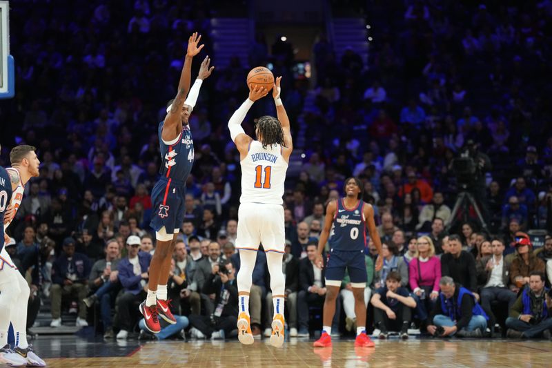 PHILADELPHIA, PA - FEBRUARY 22: Jalen Brunson #11 of the New York Knicks shoots a three point basket against the Philadelphia 76ers on February 22, 2024 at the Wells Fargo Center in Philadelphia, Pennsylvania NOTE TO USER: User expressly acknowledges and agrees that, by downloading and/or using this Photograph, user is consenting to the terms and conditions of the Getty Images License Agreement. Mandatory Copyright Notice: Copyright 2024 NBAE (Photo by Jesse D. Garrabrant/NBAE via Getty Images)