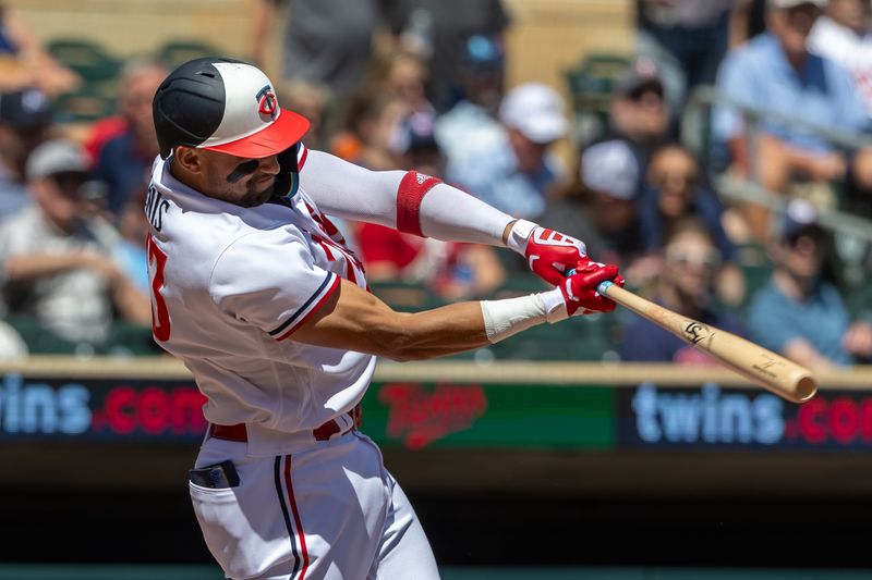 Aug 16, 2023; Minneapolis, Minnesota, USA; Minnesota Twins third baseman Royce Lewis (23) hits a single against the Detroit Tigers in the third inning at Target Field. Mandatory Credit: Jesse Johnson-USA TODAY Sports