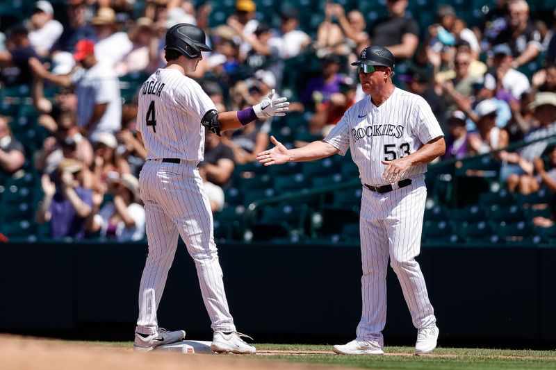 Aug 20, 2023; Denver, Colorado, USA; Colorado Rockies right fielder Michael Toglia (4) reacts with first base coach Ronnie Gideon (53) after hitting an RBI single in the fourth inning against the Chicago White Sox at Coors Field. Mandatory Credit: Isaiah J. Downing-USA TODAY Sports