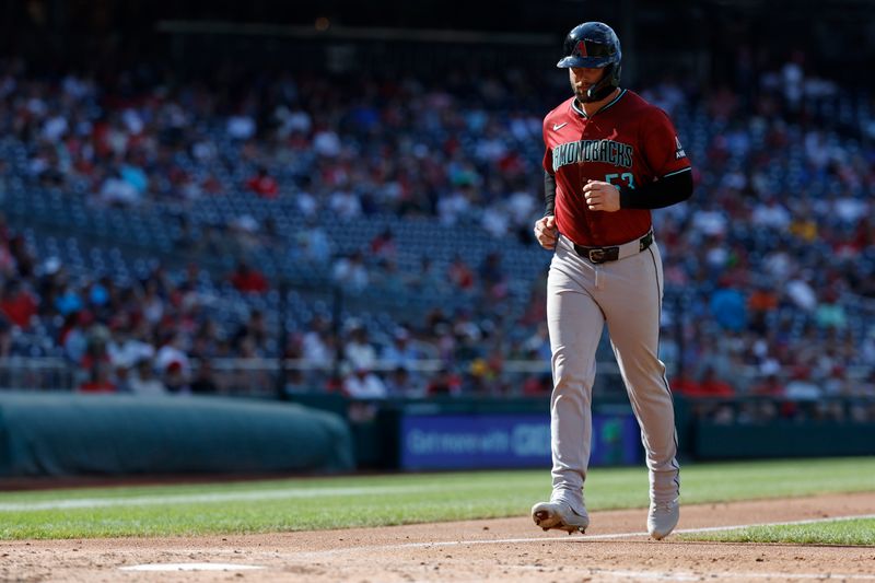 Jun 19, 2024; Washington, District of Columbia, USA; Arizona Diamondbacks first base Christian Walker (53) scores a run on a walk drawn by Diamondbacks catcher Gabriel Moreno (not pictured) with the bases loaded against the Washington Nationals during the fourth inning at Nationals Park. Mandatory Credit: Geoff Burke-USA TODAY Sports