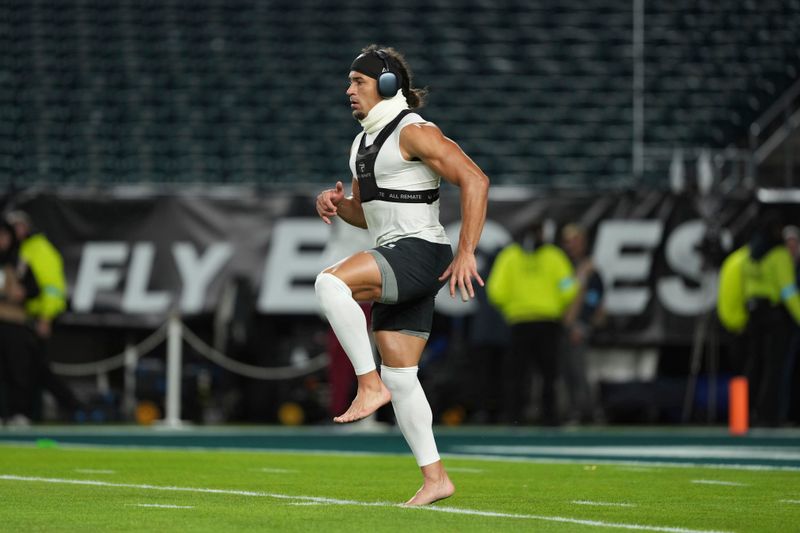 Philadelphia Eagles safety Sydney Brown warms up before an NFL football game against the Washington Commanders Thursday, Nov. 14, 2024, in Philadelphia. (AP Photo/Matt Slocum)