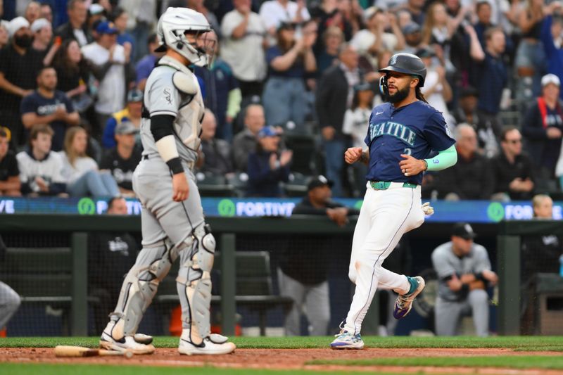 Jun 10, 2024; Seattle, Washington, USA; Seattle Mariners shortstop J.P. Crawford (3) scores a run against the Chicago White Sox during the eighth inning at T-Mobile Park. Mandatory Credit: Steven Bisig-USA TODAY Sports
