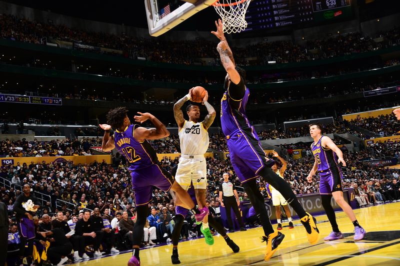 LOS ANGELES, CA - NOVEMBER 19: John Collins #20 of the Utah Jazz handles the ball during the game against the Los Angeles Lakers during the Emirates NBA Cup game on November 19, 2024 at Crypto.Com Arena in Los Angeles, California. NOTE TO USER: User expressly acknowledges and agrees that, by downloading and/or using this Photograph, user is consenting to the terms and conditions of the Getty Images License Agreement. Mandatory Copyright Notice: Copyright 2024 NBAE (Photo by Adam Pantozzi/NBAE via Getty Images)