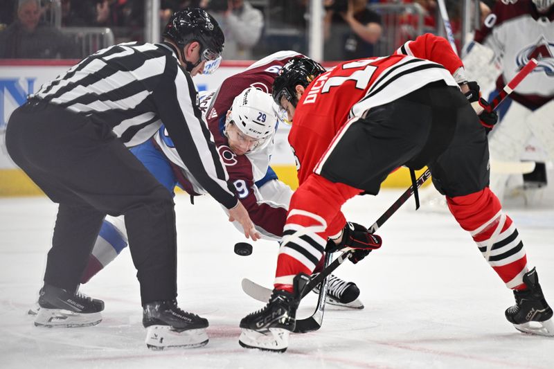 Dec 19, 2023; Chicago, Illinois, USA; Colorado Avalanche forward Nathan MacKinnon (29) takes a face off against Chicago Blackhawks forward Jason Dickinson (16) in the first period at United Center. Mandatory Credit: Jamie Sabau-USA TODAY Sports