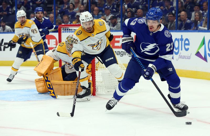 Oct 10, 2023; Tampa, Florida, USA; Tampa Bay Lightning center Michael Eyssimont (23) skates with the puck as Nashville Predators center Tommy Novak (82) defends during the first period at Amalie Arena. Mandatory Credit: Kim Klement Neitzel-USA TODAY Sports