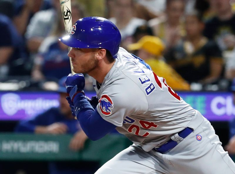 Aug 26, 2023; Pittsburgh, Pennsylvania, USA;  Chicago Cubs first baseman Cody Bellinger hits an RBI single against the Pittsburgh Pirates during the fifth inning at PNC Park. Mandatory Credit: Charles LeClaire-USA TODAY Sports