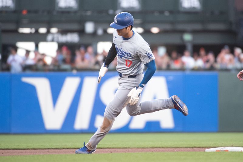 Jun 29, 2024; San Francisco, California, USA; Los Angeles Dodgers two-way player Shohei Ohtani (17) rounds second base during the tenth inning against the San Francisco Giants at Oracle Park. Mandatory Credit: Ed Szczepanski-USA TODAY Sports