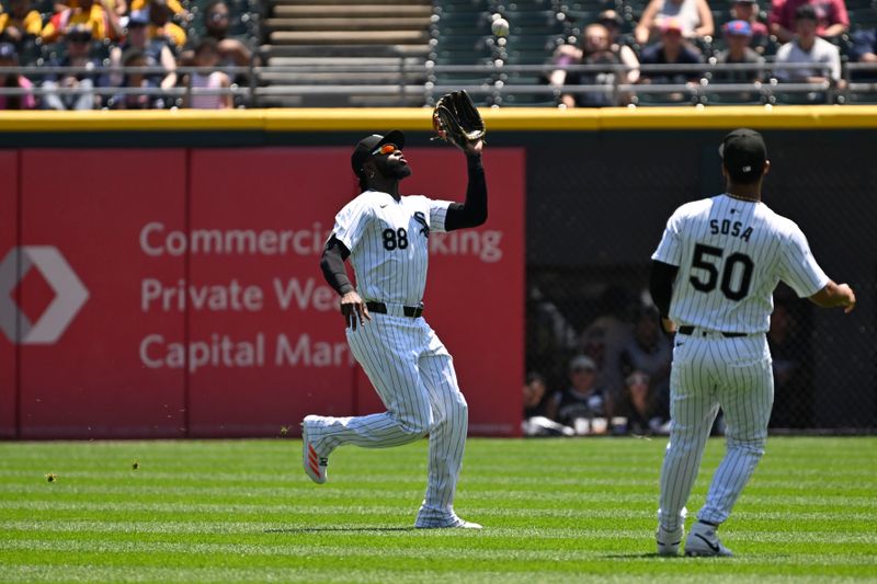 Jul 10, 2024; Chicago, Illinois, USA;  Chicago White Sox outfielder Luis Robert Jr. (88) catches a fly ball hit by Minnesota Twins third base Jose Miranda (64) during the first inning at Guaranteed Rate Field. Mandatory Credit: Matt Marton-USA TODAY Sports