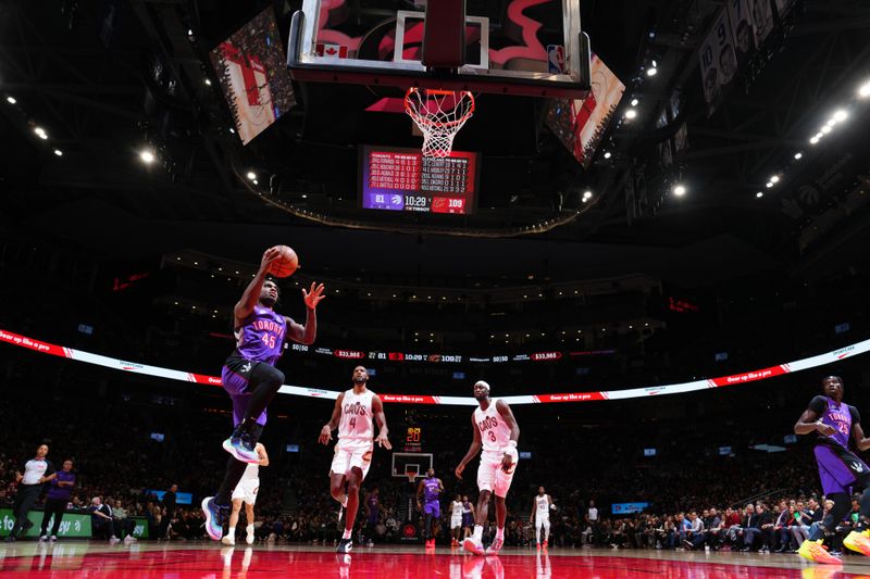 TORONTO, CANADA - OCTOBER 23: Davion Mitchell #45 of the Toronto Raptors drives to the basket during the game against the Cleveland Cavaliers on October 23, 2024 at the Scotiabank Arena in Toronto, Ontario, Canada.  NOTE TO USER: User expressly acknowledges and agrees that, by downloading and or using this Photograph, user is consenting to the terms and conditions of the Getty Images License Agreement.  Mandatory Copyright Notice: Copyright 2024 NBAE (Photo by Mark Blinch/NBAE via Getty Images)