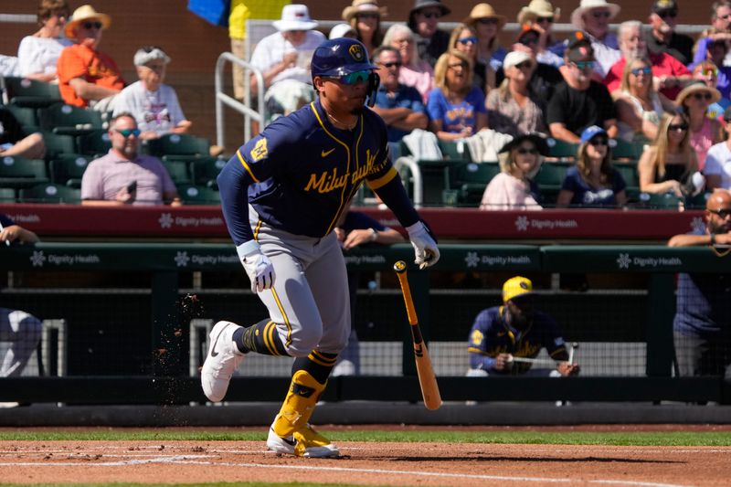 Mar 5, 2024; Scottsdale, Arizona, USA; Milwaukee Brewers catcher Willie Contreras (24) hits a single against the San Francisco Giants in the first inning at Scottsdale Stadium. Mandatory Credit: Rick Scuteri-USA TODAY Sports