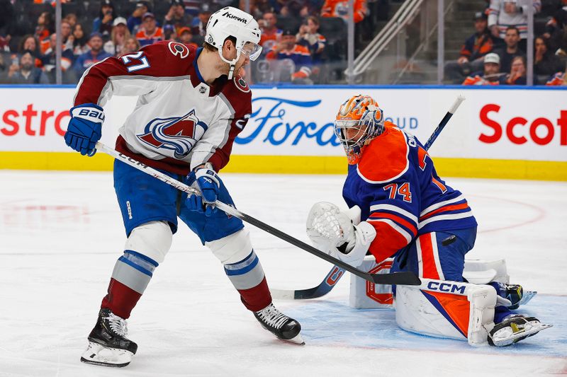 Mar 16, 2024; Edmonton, Alberta, CAN; Edmonton Oilers goaltender Stuart Skinner (74) stops Colorado Avalanche forward Jonathan Drouin (27) on a penalty shot during the second period at Rogers Place. Mandatory Credit: Perry Nelson-USA TODAY Sports