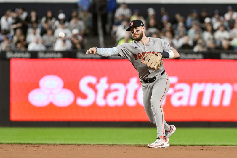 Jun 8, 2025; Bronx, New York, USA; Boston Red Sox shortstop Trevor Story (10) throws to first for an out during the fourth inning against the New York Yankees at Yankee Stadium. Mandatory Credit: John Jones-Imagn Images