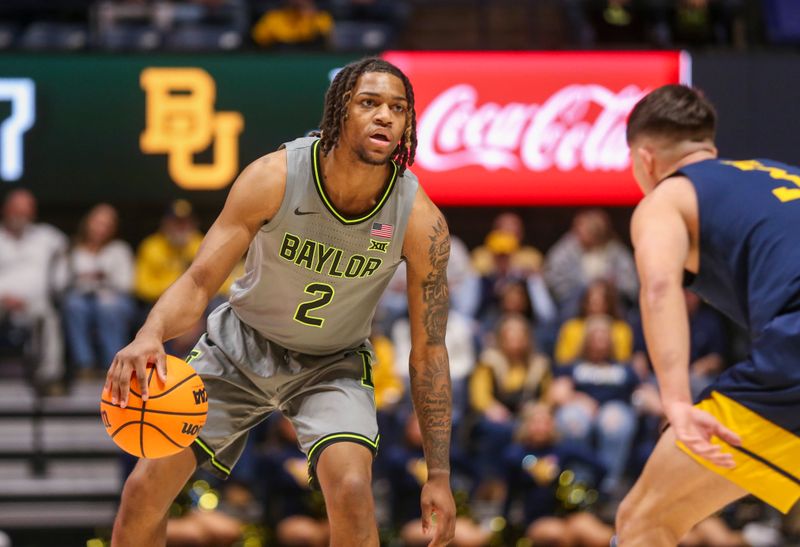 Feb 17, 2024; Morgantown, West Virginia, USA; Baylor Bears guard Jayden Nunn (2) dribbles against West Virginia Mountaineers guard Kerr Kriisa (3) during the first half at WVU Coliseum. Mandatory Credit: Ben Queen-USA TODAY Sports