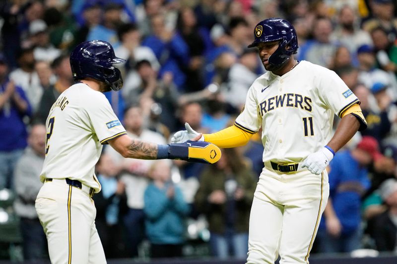 Apr 6, 2024; Milwaukee, Wisconsin, USA;  Milwaukee Brewers right fielder Jackson Chourio (11) celebrates after hitting a home run during the eighth inning against the Seattle Mariners at American Family Field. Mandatory Credit: Jeff Hanisch-USA TODAY Sports