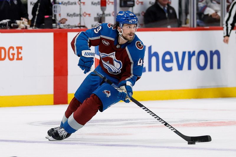 Nov 27, 2024; Denver, Colorado, USA; Colorado Avalanche defenseman Samuel Girard (49) controls the puck in overtime against the Vegas Golden Knights at Ball Arena. Mandatory Credit: Isaiah J. Downing-Imagn Images