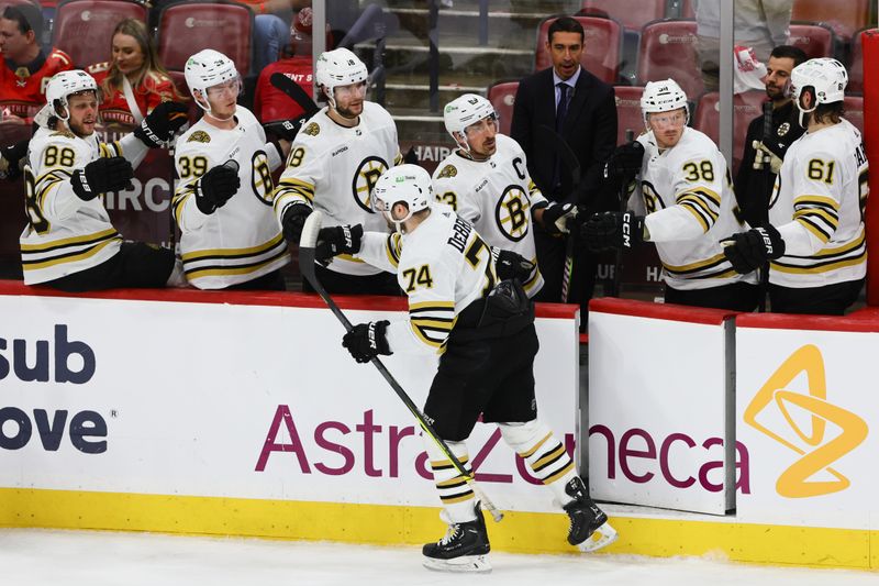 May 6, 2024; Sunrise, Florida, USA; Boston Bruins left wing Jake DeBrusk (74) celebrates with teammates after scoring against the Florida Panthers during the third period in game one of the second round of the 2024 Stanley Cup Playoffs at Amerant Bank Arena. Mandatory Credit: Sam Navarro-USA TODAY Sports