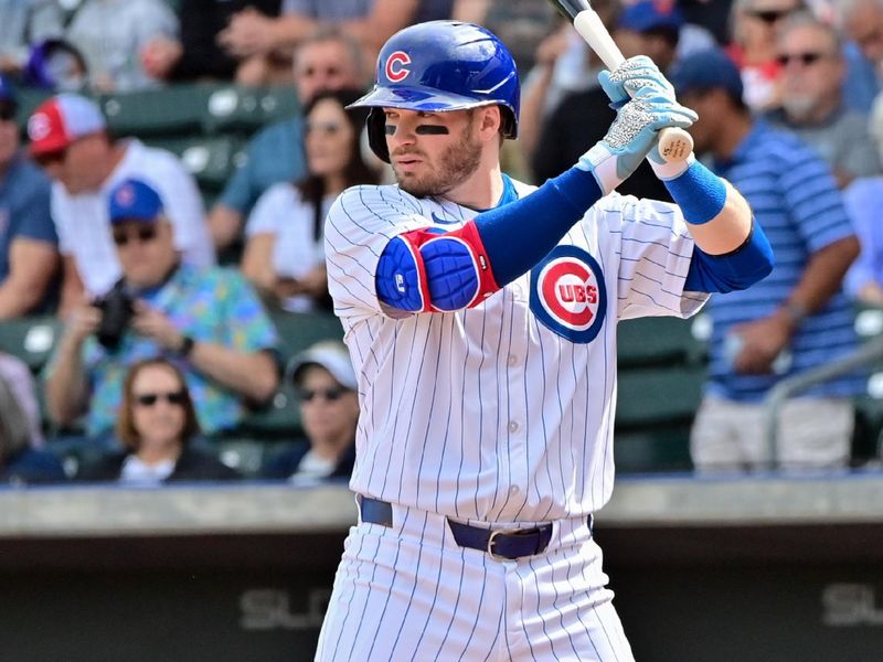 Feb 27, 2024; Mesa, Arizona, USA;  Chicago Cubs left fielder Ian Happ (8) at bat in the first inning against the Cincinnati Reds during a spring training game at Sloan Park. Mandatory Credit: Matt Kartozian-USA TODAY Sports