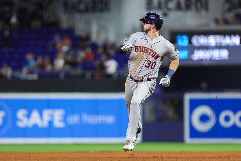 Aug 15, 2023; Miami, Florida, USA; Houston Astros right fielder Kyle Tucker (30) reaches third base on a fielding error by Miami Marlins center fielder Jazz Chisholm Jr. (not pictured) during the fifth inning at loanDepot Park. Mandatory Credit: Sam Navarro-USA TODAY Sports