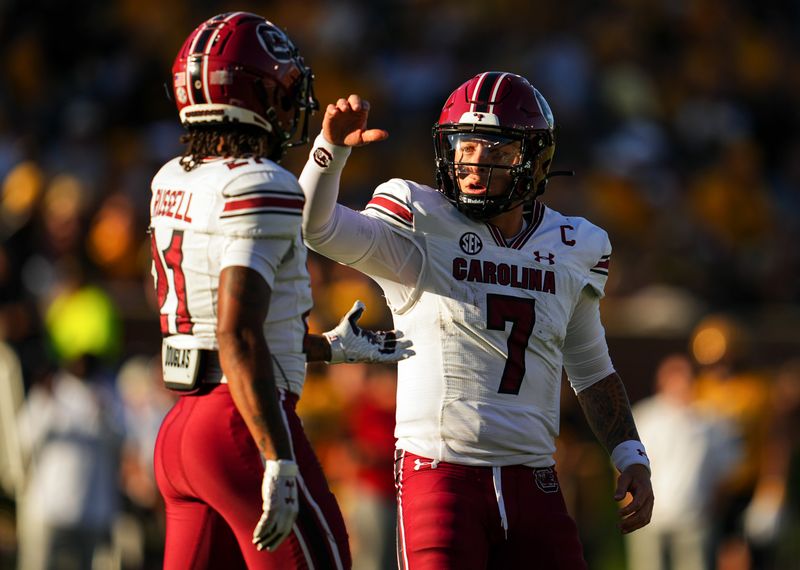 Oct 21, 2023; Columbia, Missouri, USA; South Carolina Gamecocks quarterback Spencer Rattler (7) talks to wide receiver Tyshawn Russell (21) during the second half against the Missouri Tigers at Faurot Field at Memorial Stadium. Mandatory Credit: Jay Biggerstaff-USA TODAY Sports