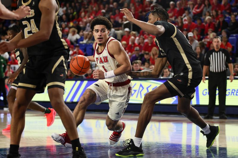 Jan 14, 2024; Boca Raton, Florida, USA; Florida Atlantic Owls guard Bryan Greenlee (4) drives to the basket against UAB Blazers forward Christian Coleman (13) during the second half at Eleanor R. Baldwin Arena. Mandatory Credit: Sam Navarro-USA TODAY Sports