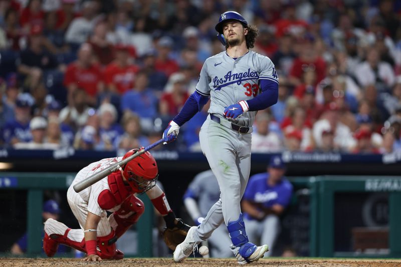 Jul 9, 2024; Philadelphia, Pennsylvania, USA; Los Angeles Dodgers outfielder James Outman (33) strikes out in front of Philadelphia Phillies catcher Rafael Marchán (13) to end the seventh inning at Citizens Bank Park. Mandatory Credit: Bill Streicher-USA TODAY Sports