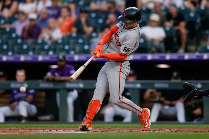 Sep 3, 2025; Denver, Colorado, USA; San Francisco Giants catcher Patrick Bailey (14) hits a single in the third inning against the Colorado Rockies at Coors Field. Mandatory Credit: Isaiah J. Downing-Imagn Images