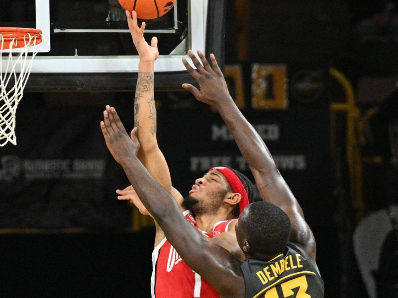 Feb 2, 2024; Iowa City, Iowa, USA; Ohio State Buckeyes guard Roddy Gayle Jr. (1) goes to the basket as Iowa Hawkeyes forward Ladji Dembele (13) defends during the second half at Carver-Hawkeye Arena. Mandatory Credit: Jeffrey Becker-USA TODAY Sports