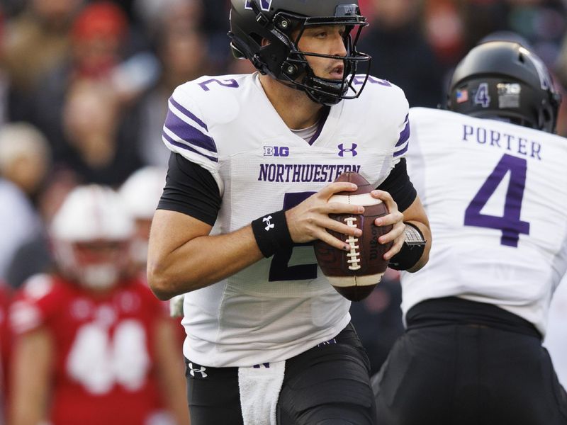 Nov 11, 2023; Madison, Wisconsin, USA;  Northwestern Wildcats quarterback Ben Bryant (2) looks to throw a pass during the first quarter against the Wisconsin Badgers at Camp Randall Stadium. Mandatory Credit: Jeff Hanisch-USA TODAY Sports